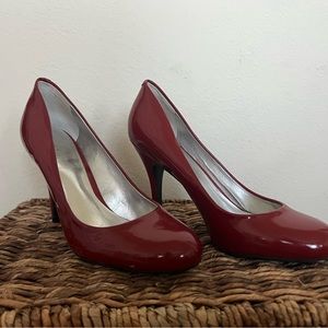 Red, patent leather heals. Rarely worn, great condition. Size 9